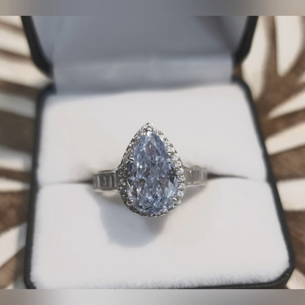 Elegant Silver Ring with Teardrop Blue Gemstone